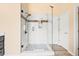 Modern bathroom featuring a frameless glass shower, white subway tile, and stylish hardware at 2915 Pruitt Rd, Cumming, GA 30041