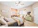 Bright bedroom with a large bed, window, and decorative details create a cozy retreat at 2915 Pruitt Rd, Cumming, GA 30041