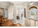 Elegant dining room featuring hardwood floors, decorative columns, and a view of the front door at 2915 Pruitt Rd, Cumming, GA 30041