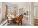 Beautiful dining room featuring a large window, decorative light fixture, and classic furnishings at 2915 Pruitt Rd, Cumming, GA 30041