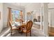 Chic dining area featuring a classic table set, chandelier, and natural light at 2915 Pruitt Rd, Cumming, GA 30041