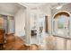 Open-concept foyer leading to the dining area, showcasing hardwood floors and ample lighting at 2915 Pruitt Rd, Cumming, GA 30041