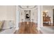 Spacious foyer with hardwood floors, decorative columns, and elegant decor at 2915 Pruitt Rd, Cumming, GA 30041