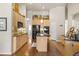 Modern kitchen with a central island, black appliances, and ample cabinet space for storage at 2915 Pruitt Rd, Cumming, GA 30041