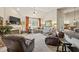 Spacious living room with large windows, plush carpet, and a cozy fireplace at 2915 Pruitt Rd, Cumming, GA 30041
