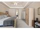 Spacious main bedroom featuring a tray ceiling, neutral color palette, and ample closet space at 2915 Pruitt Rd, Cumming, GA 30041