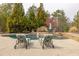 Inviting pool area with stone accents, waterfall feature and lounge chairs, perfect for relaxation and outdoor entertainment at 2915 Pruitt Rd, Cumming, GA 30041