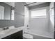 Modern bathroom with a shower-tub combination, a mirrored vanity, and tile walls at 3449 Hyland Dr, Decatur, GA 30032