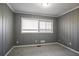 Bedroom featuring a large window, soft carpet, and wainscotting at 3449 Hyland Dr, Decatur, GA 30032