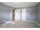 Bedroom with gray walls, neutral carpet, and access to the hallway at 3449 Hyland Dr, Decatur, GA 30032