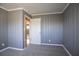 Bedroom with gray wainscotting, neutral carpet, and access to the hallway at 3449 Hyland Dr, Decatur, GA 30032