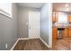 Entryway with wood floors and a kitchen view featuring stainless steel appliances at 3449 Hyland Dr, Decatur, GA 30032