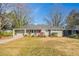 Charming one-story home featuring a covered entrance, grey paint, and a well-maintained front yard at 3449 Hyland Dr, Decatur, GA 30032