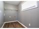 A simple laundry room featuring durable laminate flooring and wire shelving at 3449 Hyland Dr, Decatur, GA 30032