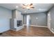 Bright living room featuring a grey brick fireplace, hardwood floors, and natural light at 3449 Hyland Dr, Decatur, GA 30032