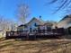 Enjoy outdoor living with a large wooden deck ideal for gatherings, with a table and chairs at 4584 Madison Place Ln, Atlanta, GA 30360