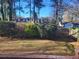 Backyard with privacy fence and mature trees creating a serene outdoor space at 4584 Madison Place Ln, Atlanta, GA 30360