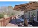 Wooden deck featuring dining and grilling spaces, and a view of the surrounding neighborhood at 4584 Madison Place Ln, Atlanta, GA 30360