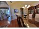 Open dining room featuring a spacious table with seating for six and adjacent to a staircase at 4584 Madison Place Ln, Atlanta, GA 30360