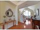 Elegant foyer with hardwood floors, staircase, and decorative mirror at 4584 Madison Place Ln, Atlanta, GA 30360