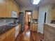 Functional kitchen features granite countertops, gas cooktop, stainless steel refrigerator, and wood cabinets at 4584 Madison Place Ln, Atlanta, GA 30360