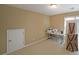 Versatile room with neutral carpeting, a small window, and a closet or storage area at 4584 Madison Place Ln, Atlanta, GA 30360