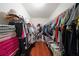 Walk-in closet with ample storage and hardwood floors at 4584 Madison Place Ln, Atlanta, GA 30360