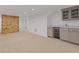 This basement features a brick fireplace and a kitchenette with countertop and cabinets at 4755 Huntley Dr, Atlanta, GA 30342