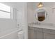 Cozy bathroom with white subway tile, bath tub and gray vanity with marble countertop at 4755 Huntley Dr, Atlanta, GA 30342