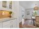 Dining room featuring a modern table, stylish chairs and elegant built-in display cabinets at 4755 Huntley Dr, Atlanta, GA 30342