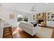 Bright living room featuring hardwood floors, brick fireplace, and sliding doors to the backyard at 4755 Huntley Dr, Atlanta, GA 30342