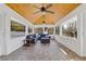 Relaxing sunroom features tiled floors, ceiling fans, and comfortable seating for enjoying the outdoors from inside at 4755 Huntley Dr, Atlanta, GA 30342