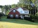 Charming two-story home with a combination of brick and siding at 100 Shoreline Dr, Fayetteville, GA 30215