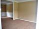 Inviting living room with neutral carpeting, baseboards, and fresh paint at 100 Shoreline Dr, Fayetteville, GA 30215