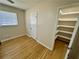 Bedroom with wooden floor, closet, and window allowing natural light at 1010 Wesley Park Sw Dr, Marietta, GA 30064