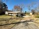 A long driveway leads to this ranch-style home with a charming front porch at 1010 Wesley Park Sw Dr, Marietta, GA 30064