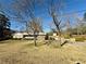 View of the house across the front yard with mature trees at 1010 Wesley Park Sw Dr, Marietta, GA 30064