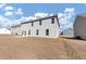 Spacious backyard and gray siding on the exterior of this lovely two-story home at 1734 Cadence St, Locust Grove, GA 30248