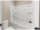 Bathroom featuring a shower and bathtub at 1734 Cadence St, Locust Grove, GA 30248