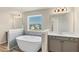 Bathroom features freestanding tub, double vanities, and natural light at 1734 Cadence St, Locust Grove, GA 30248