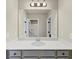 Bathroom featuring neutral walls, a long mirror, a sink and two doorways at 1734 Cadence St, Locust Grove, GA 30248