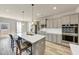 Beautiful kitchen with a large island, stainless steel appliances, and modern grey cabinets at 1734 Cadence St, Locust Grove, GA 30248