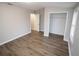 Spacious bedroom with an ensuite bathroom features wood-look floors and a closet at 2084 North Rd, Snellville, GA 30078