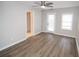 Bright bedroom with wood-look floors, a side door, and plenty of natural light at 2084 North Rd, Snellville, GA 30078