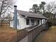 Charming single-story home with a stone chimney and inviting front porch at 2084 North Rd, Snellville, GA 30078