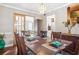 Cozy dining room with a modern chandelier, seating for six, and access to the game room at 4704 Keighley Dr, Stone Mountain, GA 30083