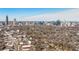 A dynamic aerial view featuring the city skyline behind the property, enhancing its location appeal at 513 Saint Charles Ne Ave, Atlanta, GA 30308