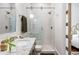 Bathroom featuring vanity, marble shower, and sliding door at 513 Saint Charles Ne Ave, Atlanta, GA 30308