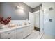 Gray bathroom with marble countertop, shower, and decorative accents at 513 Saint Charles Ne Ave, Atlanta, GA 30308