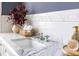 Close up on a marble countertop with white backsplash, towels, and faucet at 513 Saint Charles Ne Ave, Atlanta, GA 30308